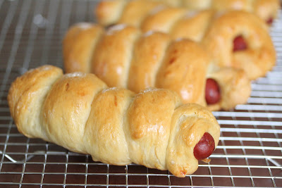close-up photo of sausage rolls on a baking rack