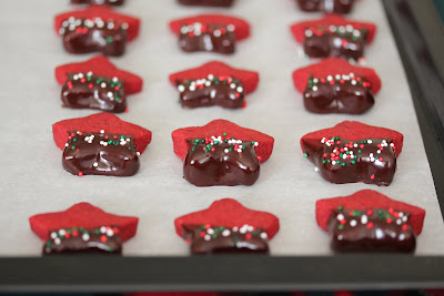 photo of Red Velvet Shortbread Cookies lined up on a baking sheet