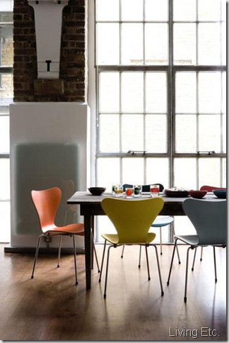 Dining room loft style floor to ceiling windows rustic table colourful Arne Jacobsen designer chairs 3107 series 7 chair wood flooring L etc 03/2007 pub orig