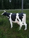 Lehmä tien reunalla
