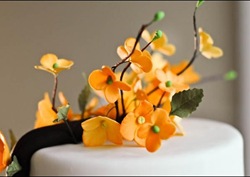 orange flowering branch wedding cake