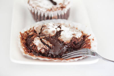 photo of a lava cake with chocolate oozing out