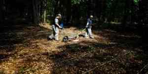 Carey Baxter (left) and Mike Hargrave, both with the U.S. Army Engineer Research and Development Center, use a ground-penetrating radar to search for burial plots at Fort Gordon. Before the government took over the more than 56,000 acres in 1941, the area included the farming community of Pinetucky