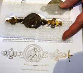 An illustration of a first century AD horse harness found during the dig, shown with the genuine article