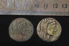 This undated photo released by the Egyptian Supreme Council of Antiquities on Thursday, April 22, 2010, shows some of 383 recently-unearthed bronze coins, said by the Supreme Council to be inscribed with the hybrid Greek-Egyptian god Amun-Zeus on one side, with an eagle and the words Ptolemy and king in Greek on the other side, dating back to King Ptolemy III who ruled Egypt in the 3rd century B.C. Descendants of one of Alexander the Great's generals, the Ptolemaic dynasty ruled Egypt for some 300 years, fusing Greek and ancient Egyptian cultures. (AP Photo/Supreme Council of Antiquities) 