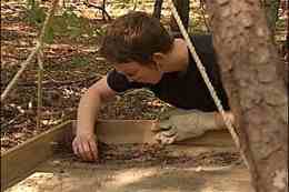 An investigator with the University of South Carolina’s SC Institute of Archaeology sifts to find artifacts from an archeological site at Fort Jackson on Friday in Columbia