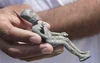 A recently excavated statuette of a boy Pharaoh dating from the 4th or 5th century B.C. is held onboard the Princess Duda research boat, anchored in the harbor of Alexandria, Egypt, Tuesday, May 25, 2010. An international team of archaeological divers led by French underwater archaeologist Franck Goddio is using advanced technology to explore the submerged ruins of a palace and temple complex from where Queen Cleopatra ruled, painstakingly excavating one of the richest underwater archaeological sites in the world and retrieving stunning artifacts from the last dynasty to rule over ancient Egypt before the Roman Empire annexed it in 30 B.C.