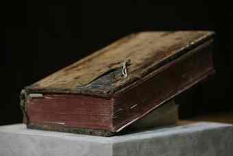 A recovered prayer book, from the XVIII century, is displayed at the Mexican National Institute of Anthropology and History, INAH, in Mexico City, Tuesday, July 27, 2010. At least 14 pieces of sacred art and 180 archaeological pieces, stolen from diverse institutions and Mexican churches, have been recovered during 2010 in three different raids, INAH authorities said.