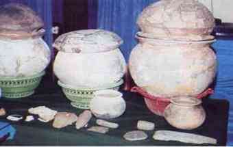 Pottery pieces and stone artifacts found in the excavations