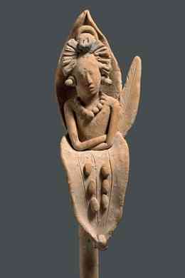 Figurine of the young Maize God emerging from a corn stalk from Jaina Island, Mexico