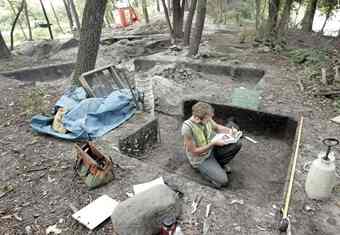 Madison Archeologist Zac Stencil works on a profile at an excavation unit by making a record sediment change with scale drawings and photos at an archeological dig on Highway 26 near Fort Atkinson.