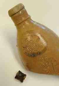 A mineral water bottle found at the shipwreck site bears a stamp that shows it was made in Ransbach, Germany. (The News Journal/GARY EMEIGH)