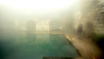 A visitor to the baths, wreathed in steam.