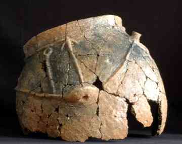 A decorated storage vessel. It is hard work for archaeologists to piece together the scattered shards. 
