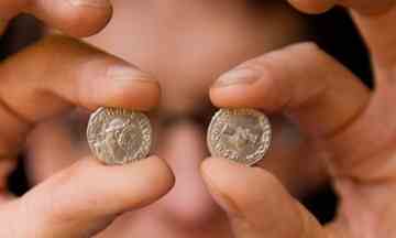 Two coins from the Roman coin hoard found at Frome which was valued at £320,250. Photograph: Linda Nylind for the Guardian