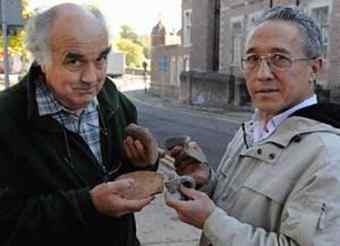 Steve Clarke and Paul Davies with some of the artefacts they have found during the dig.