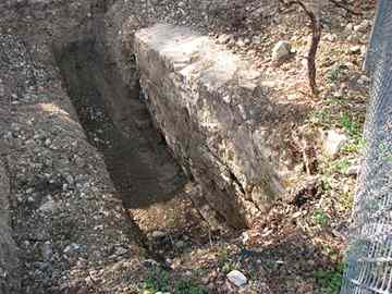 This stone wall, seen in an undated courtesy photo provided by the San Antonio Office of Historic Preservation, buried about 2 feet below the surface at the Brackenridge Golf Course is believed to have been a "wing wall" from a late-1800s millrace, used to carry water from the San Antonio River.