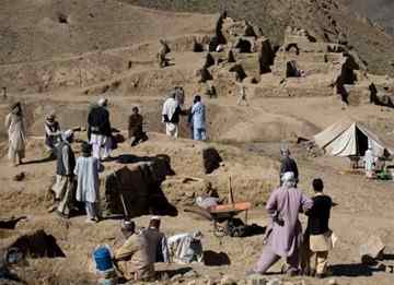 Men work on the excavation of a sprawling 2,600-year-old Buddhist monastery in Mes Aynak, south of Kabul, Afghanistan. The archaeological dig is located at the world's second-biggest unexploited copper mine. The Chinese government-backed mining company, China Metallurgical Group Corp., which won the contract to exploit the site, has given archaeologists three years to finish the excavations. Photo: Dusan Vranic / AP 