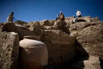 Men work on the excavation of a sprawling 2,600-year-old Buddhist monastery in Mes Aynak, south of Kabul, Afghanistan. The archaeological dig is located at the world's second-biggest unexploited copper mine. The Chinese government-backed mining company, China Metallurgical Group Corp., which won the contract to exploit the site, has given archaeologists three years to finish the excavations. Photo: Dusan Vranic / AP 