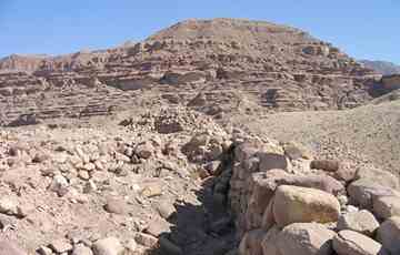 Remains of Early Bronze Age City Wall at Numeira archaeological site.
