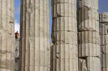 A Greek surveyor works above the pediment of the ancient Parthenon temple on the Acropolis in Athens. (AP)