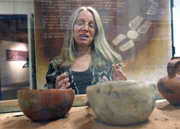 Al Hartmann  |  The Salt Lake Tribune <br />Teri Paul museum director for Edge of the Cedars State Park Museum describes one of the displays of Anasazi pottery at the museum. <br /> 6/12/09