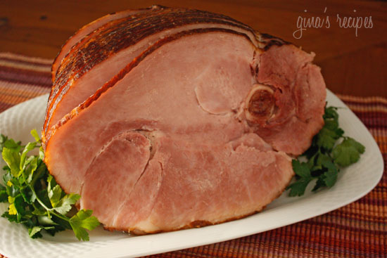 Baked spiral ham with a simple homemade glaze using fresh orange juice, honey, pineapple juice, dijon mustard and a touch of brown sugar makes this a perfect dish for the Holidays!