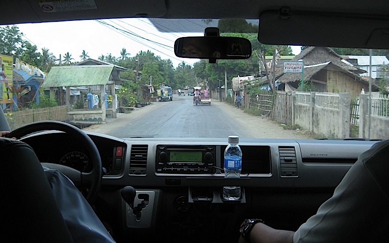 a small town in Marinduque through a van's windshield