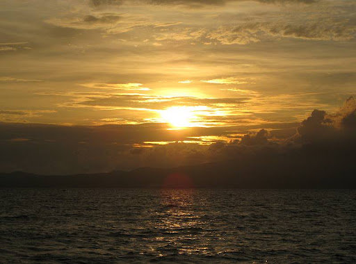 sunset over the Bataan Peninsula from the middle of Manila Bay