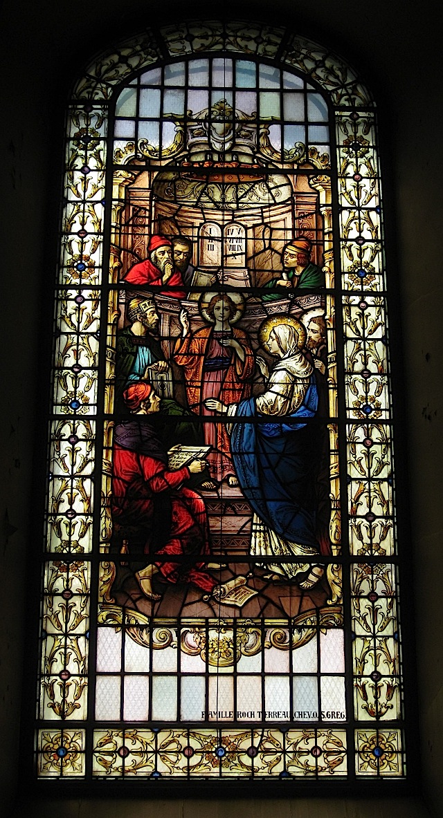 stained glass window at the Notre-Dame de Québec depicting the finding of Jesus in the temple