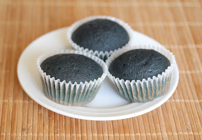 photo of three blueberry cupcakes on a plate