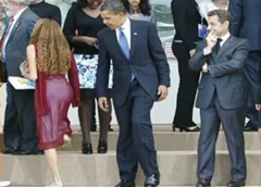 President Barack Obama seemingly checking out the backside of a girl at the G-8 summit in Italy picture