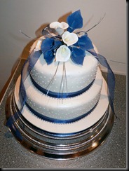 2 tier purple lillies wedding cake