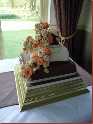 3-tier-Rose-with-chcolate-and-ivory-layers-wedding-cake-at-dunkenhalgh