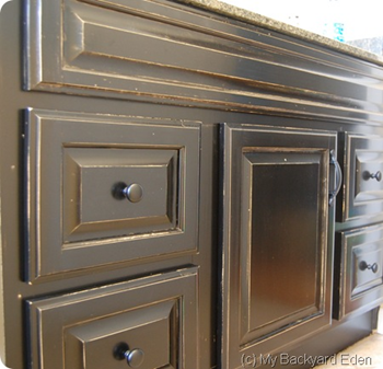 refinished my bathroom vanity with a sleek black stain.