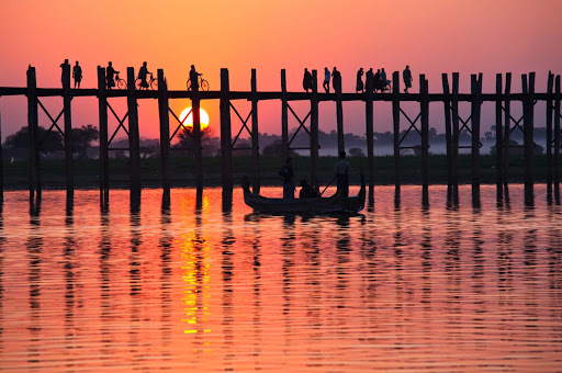 U-Bein-Bridge-in-Amarapura-Myanmar - U Bein Bridge spans Taungthaman Lake near Amarapura in Myanmar. The 4,000-foot-long bridge was built around 1850 and is believed to be the oldest and longest teakwood bridge in the world. See it on a luxury river cruise aboard the AmaPura.
