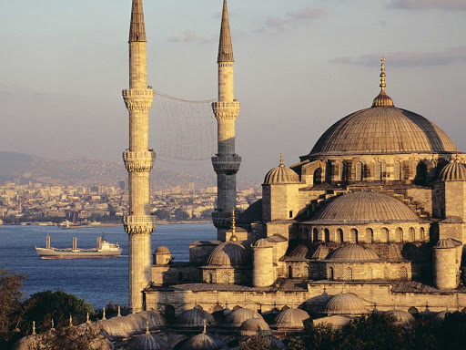 The magnificient 17th-century Sultan Ahmed Mosque, or Blue Mosque, in Istanbul, Turkey, is distinguished by a casdade of domes and six slender minarets.