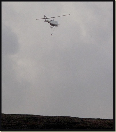 This helicopter spent all day dropping bags of hessian around us