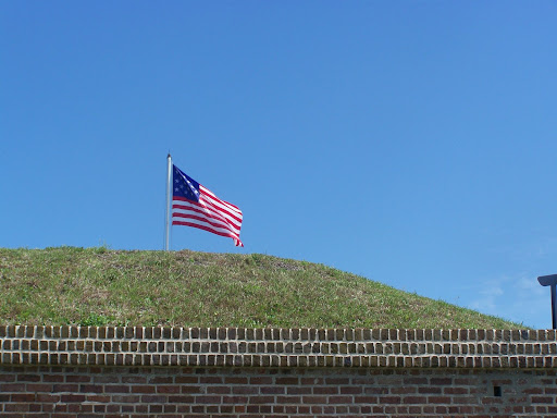 The Star Spangled Banner (15 stripes and stars) flies above Fort Moultrie.