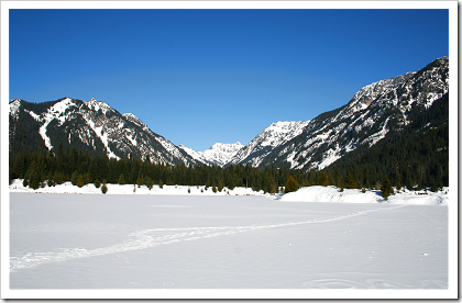 Gold Creek: mountains frame the snowy pond