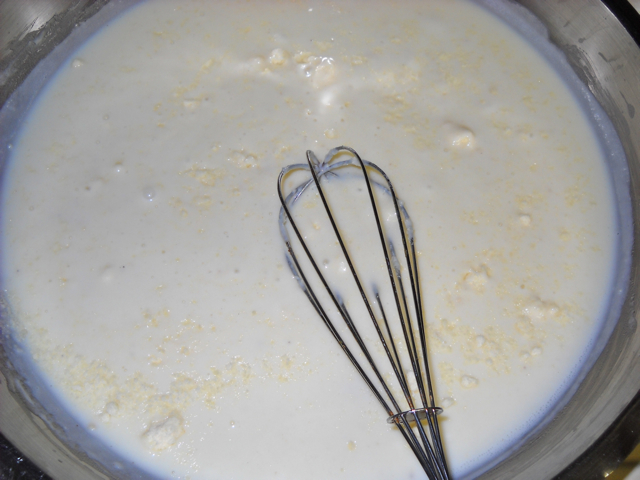 add milk and parmesan to mixture and whisk 