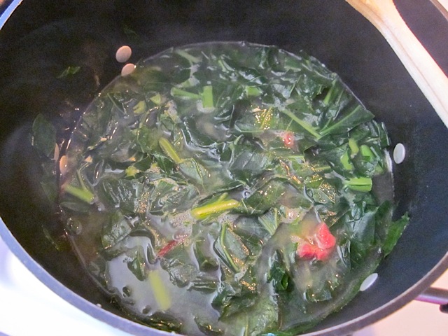simmered collard greens in pot 