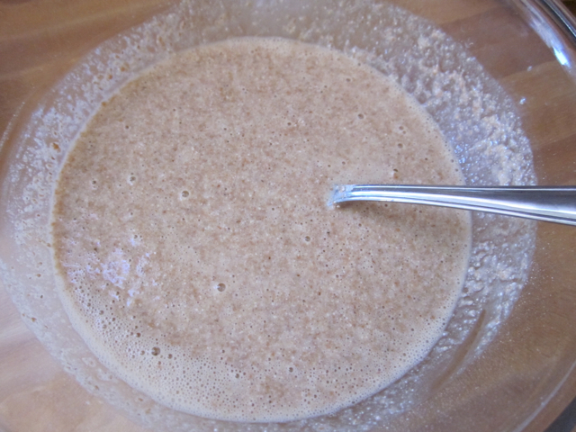 stone ground flour added to wet ingredients in mixing bowl 