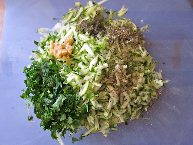 grated and seasoned zucchini with remainder of ingredients: chopped parsley, minced garlic, oregano, basil, salt and pepper