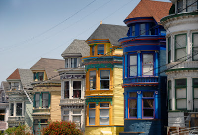 CityListen Audio Tours - Painted Victorian houses on a hill in the Haight Ashbury district of San Francisco