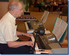 John Beales playing his Korg Pa500 keyboard