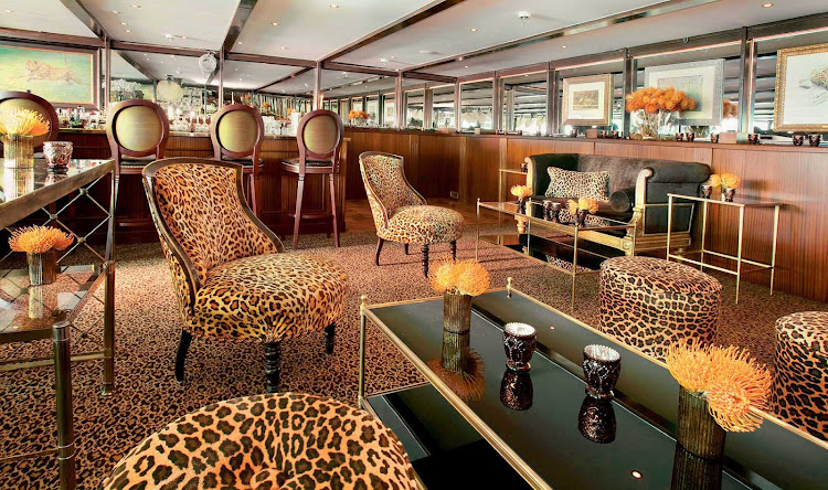 Enjoy pre-dinner drinks in S.S. Antoinette's lavish Bar du Leopard during your Uniworld cruise on the Rhine River.