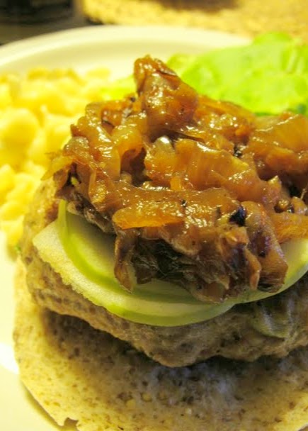 Caramelised onions on sage/onion pork burger with apples and mustard