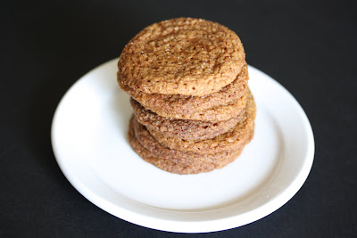 photo of a stack of molasses cookies on a plate