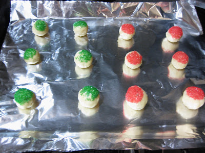 photo of dough balls topped with sprinkles ready to be baked